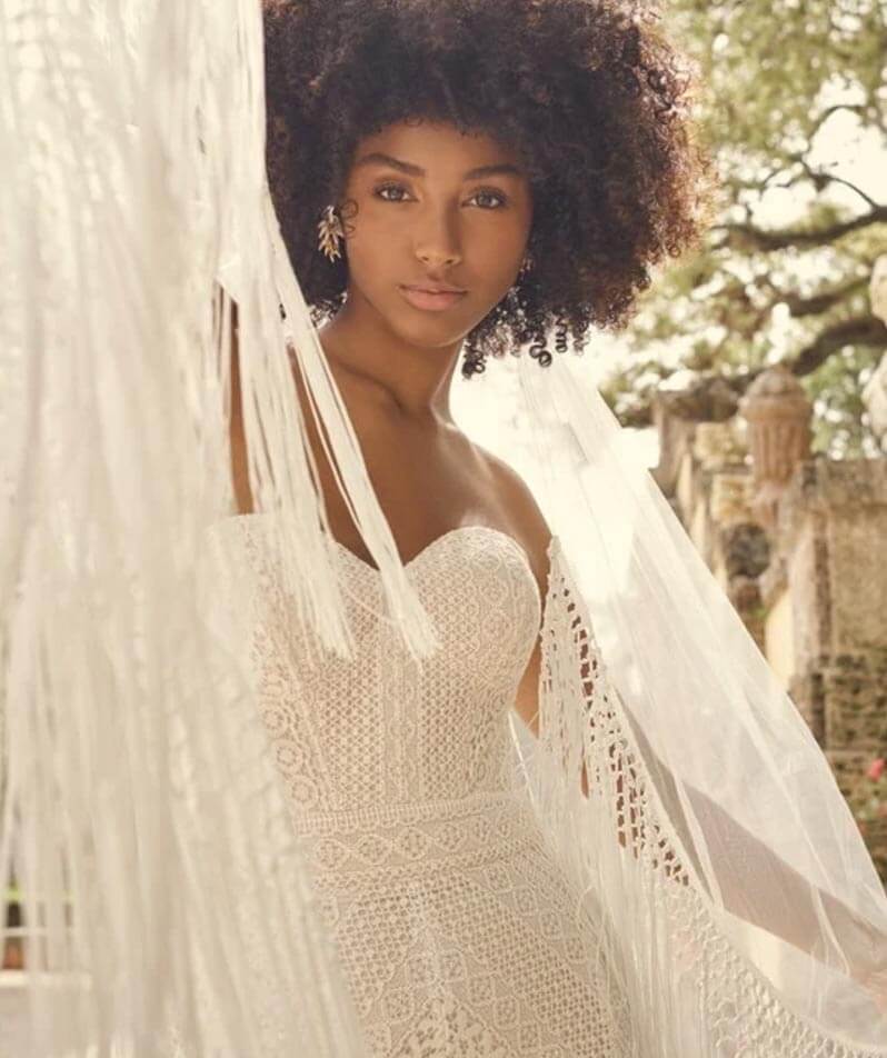 Model wearing a white gown by Maggie Sottero