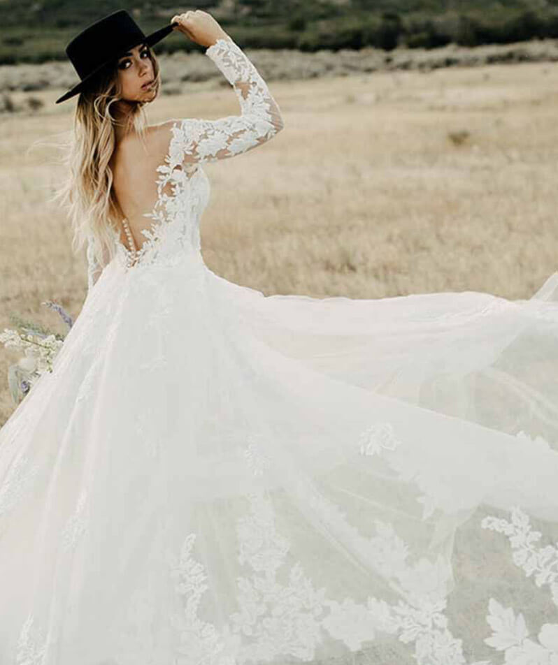 Model wearing a white gown by Martina Liana