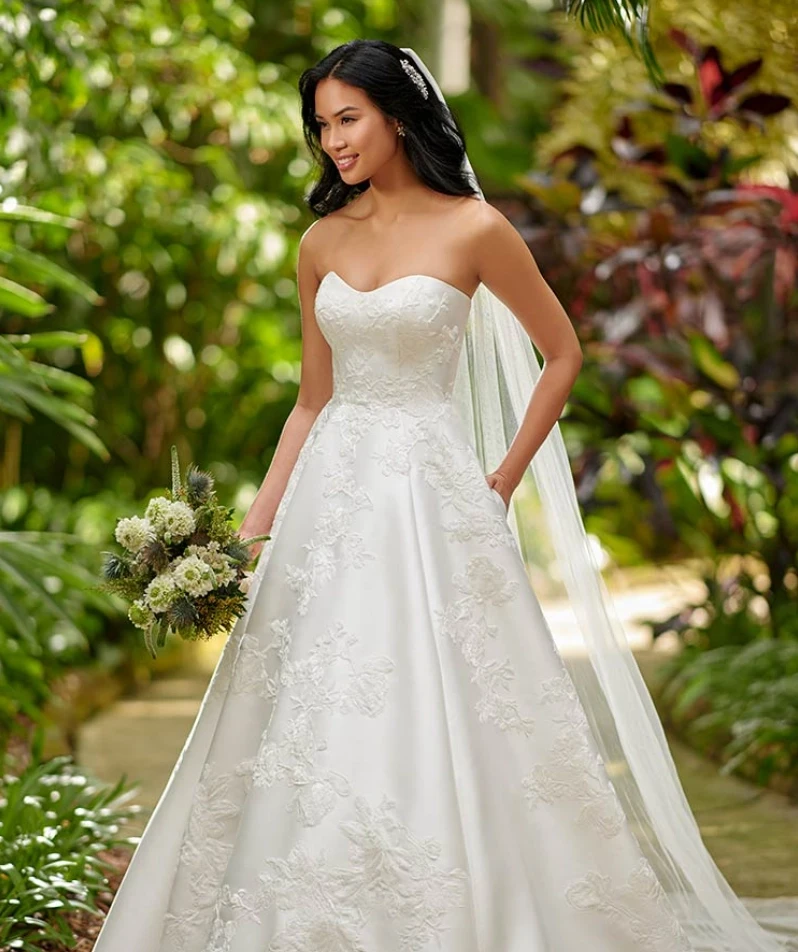 Model wearing a white gown by Essense of Australia