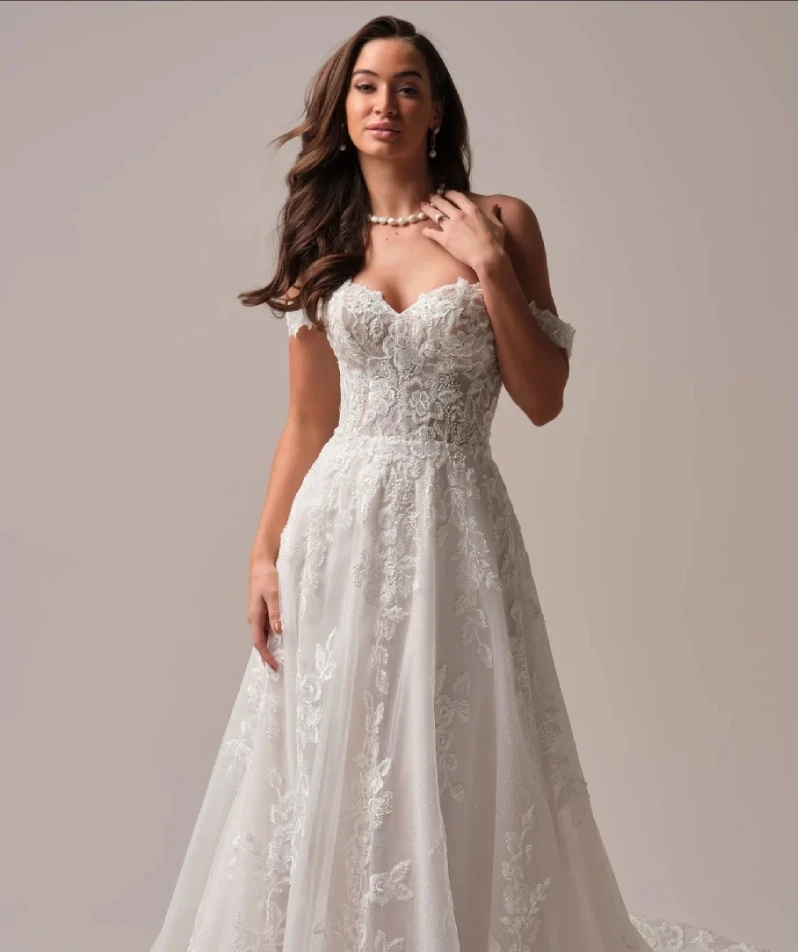 Model wearing a white gown by Maggie Sottero
